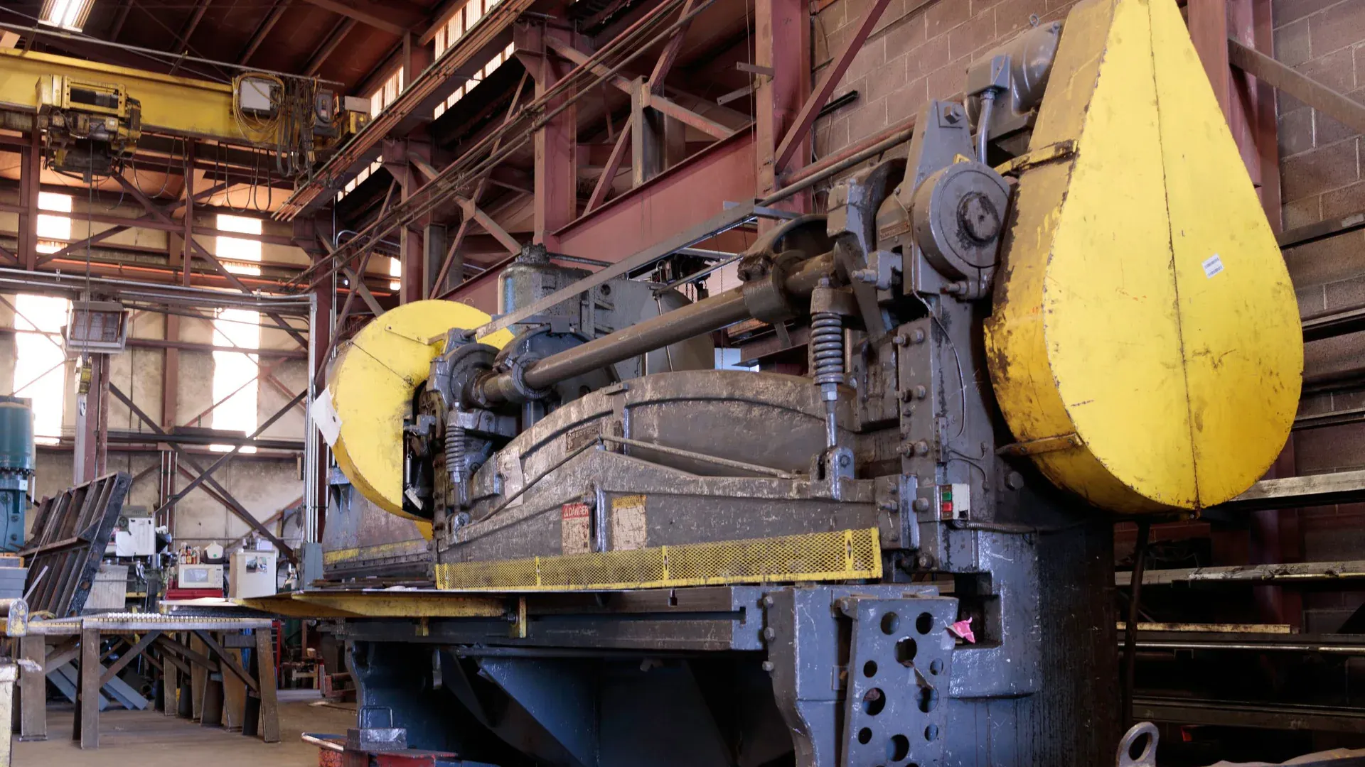 Heavy-duty industrial machine in a factory's production line, showcasing machinery details
