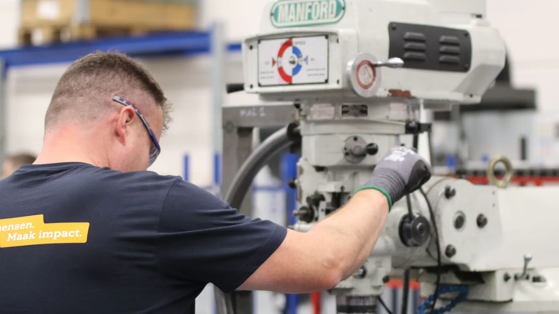 Operator receiving hands-on instruction at an industrial machine control