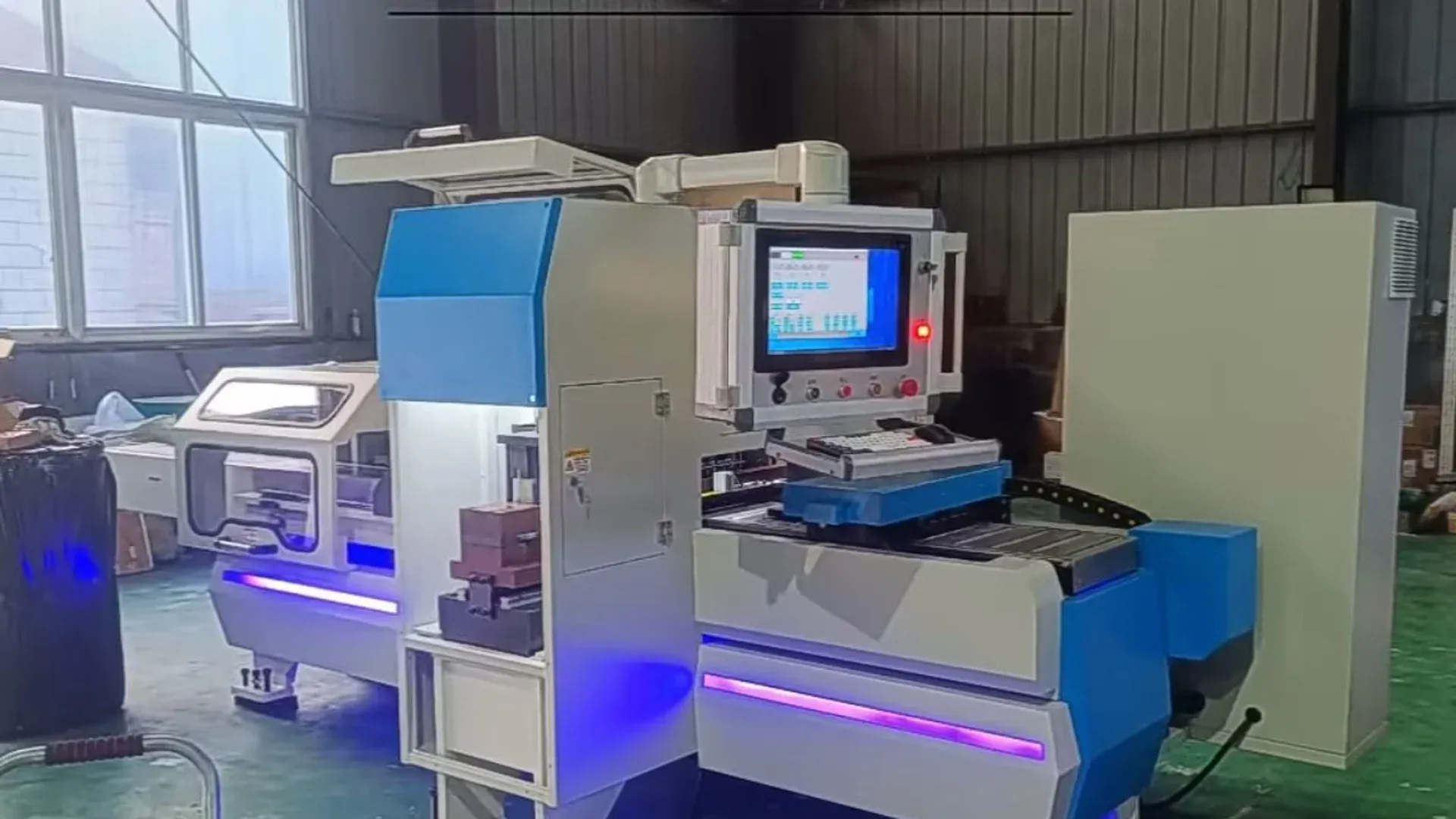 A CNC busbar processing machine installed on a factory floor
