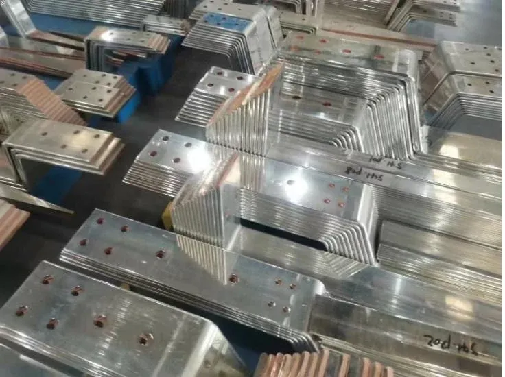 Formed metal busbar parts with drilled holes and exposed edges
