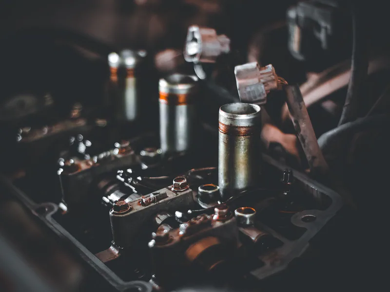 Detailed view of engine parts showcasing camshaft and cylinder head mechanics