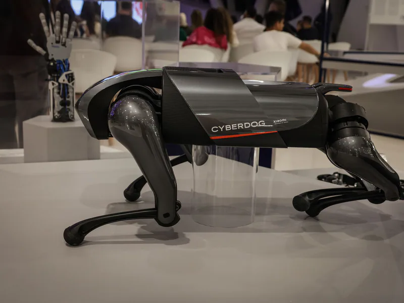 A futuristic robot dog, the Cyberdog, on display in an indoor setting, showcasing advanced robotics technology