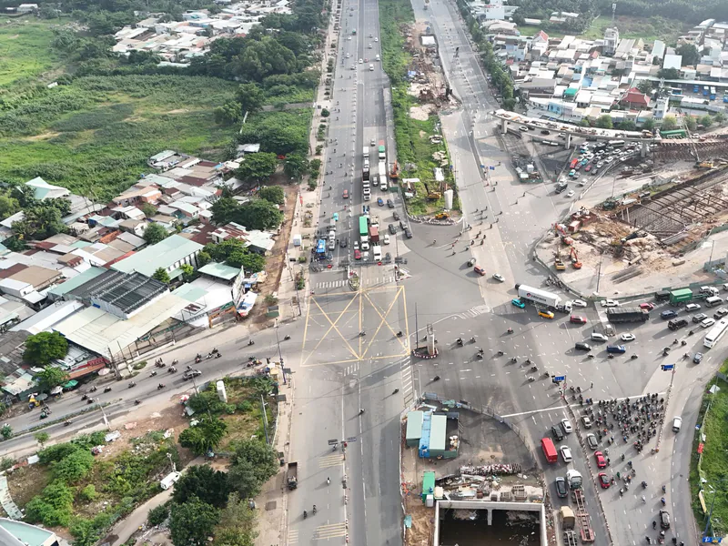 An aerial view of traffic and construction at a major intersection in Ho Chi Minh City, Vietnam