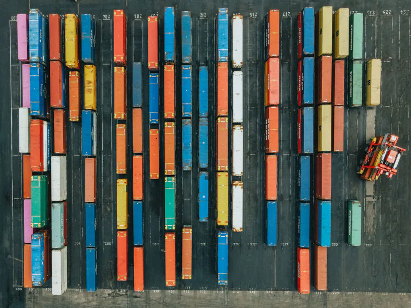 Aerial shot of colorful cargo containers in a logistics hub, Scotland