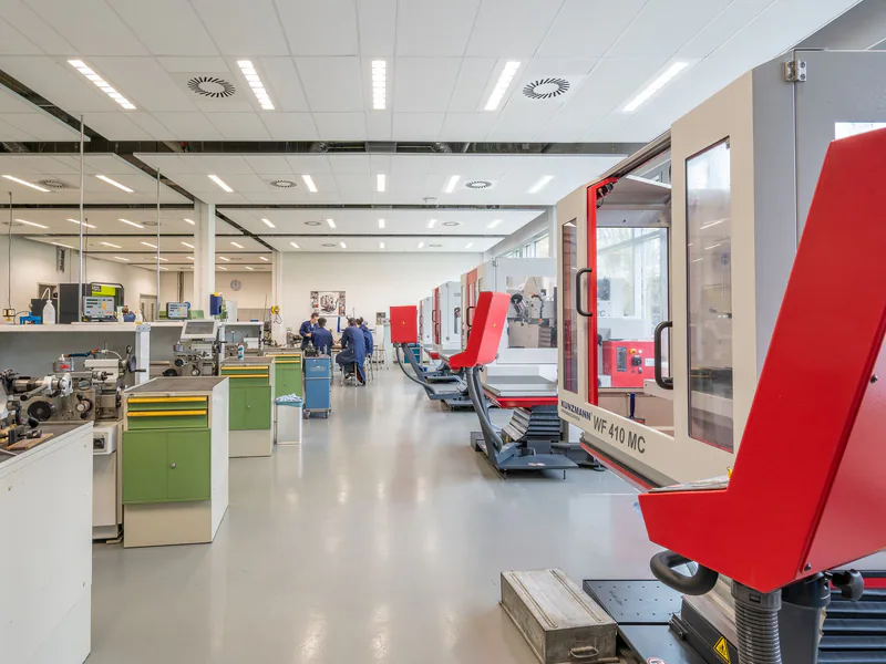 Spacious workshop with state-of-the-art machinery, highlighting industry and technology