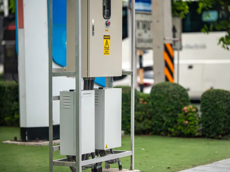 Outdoor EV charging equipment installed beside a parking area