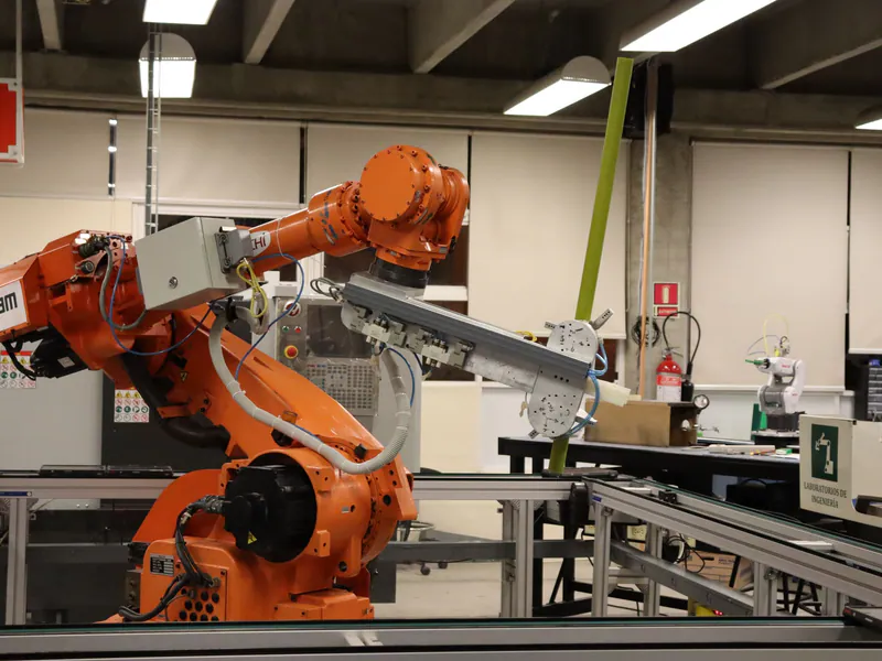 Industrial robot operating on a precision manufacturing line
