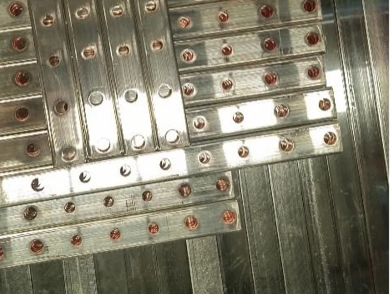 Rows of bolted conductor assemblies prepared for electrical comparison