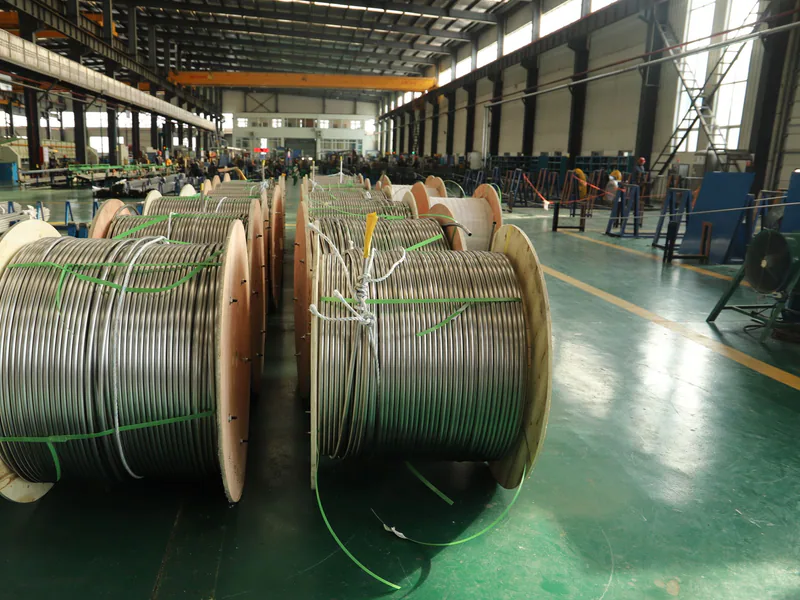 Large cable reels received inside an industrial manufacturing facility