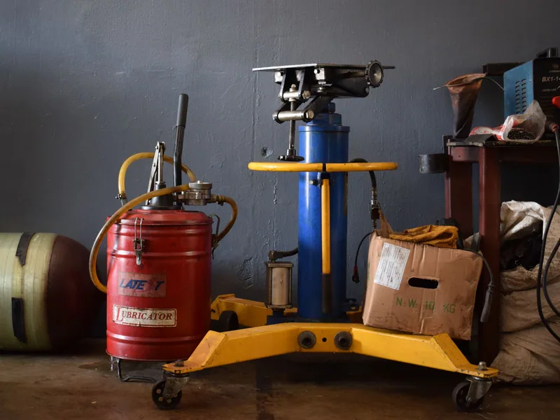 Machine maintenance tools and service supplies arranged in a workshop