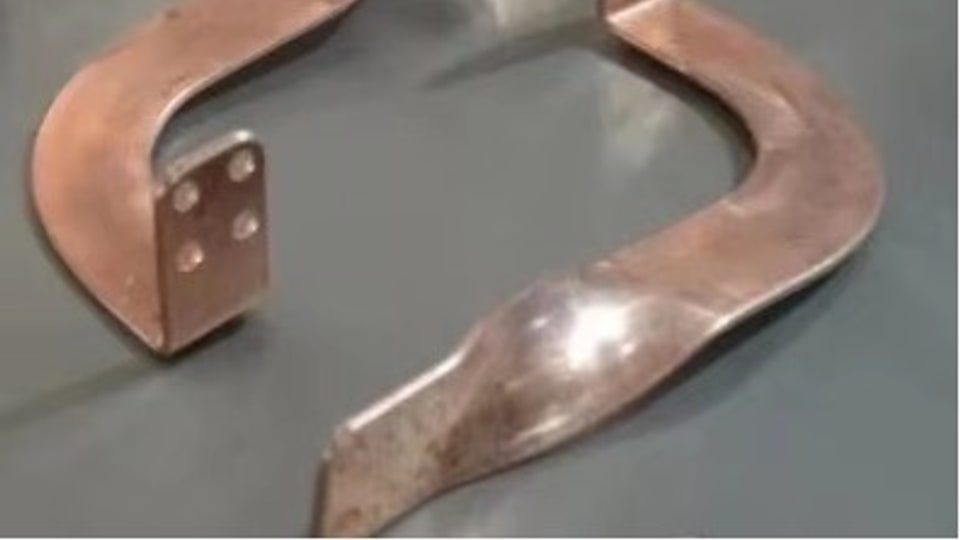 Precision-formed copper bend used to validate springback compensation accuracy